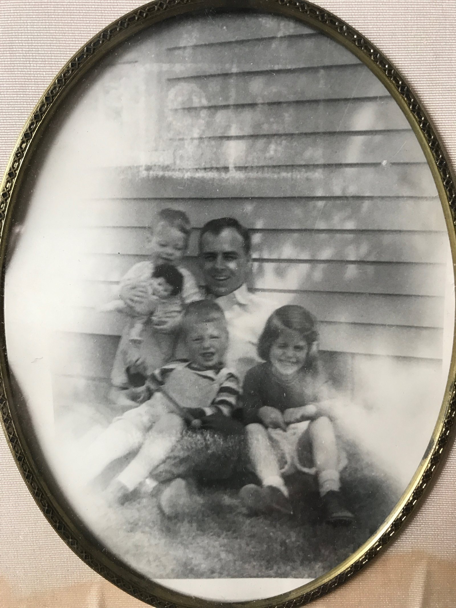 Guy with the children on the front steps, 1950s